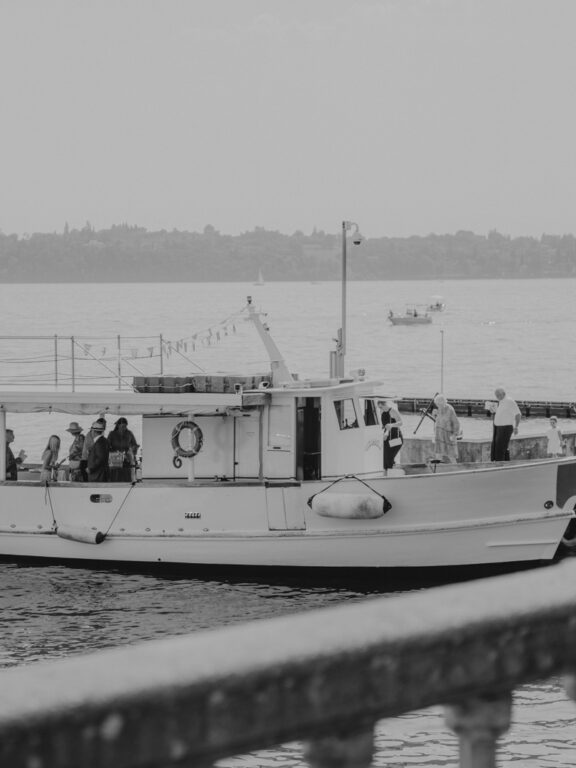 Villa Bissiniga | Lago di Garda 9 Wedding guests boarding a boat at the port of Lake Garda
