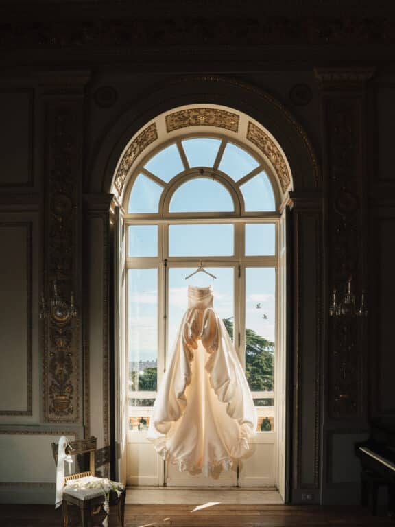 Wedding dress hanging at the window of Villa Aurelia, Rome